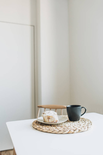 Morning breakfast with coffee and dessert on table. Minimal interior design concept. - Valokuva, kuva