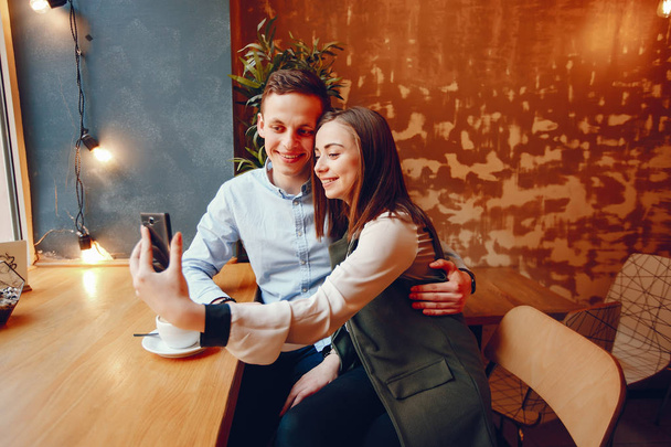 cute couple in a cafe - Φωτογραφία, εικόνα