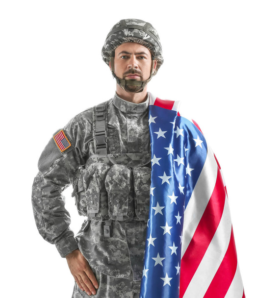 Soldier with national flag of USA on white background - Photo, image