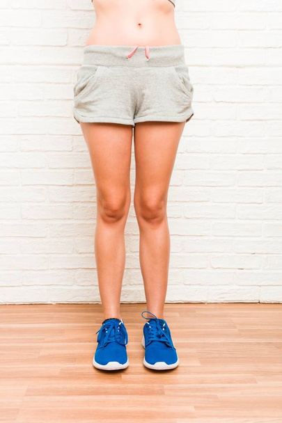 Legs of a young caucasian sporty woman - Фото, изображение