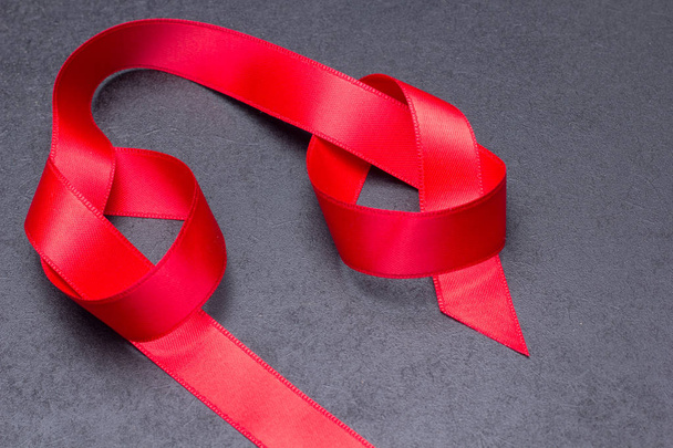 Nice red ribbon to wrap gifts - 写真・画像