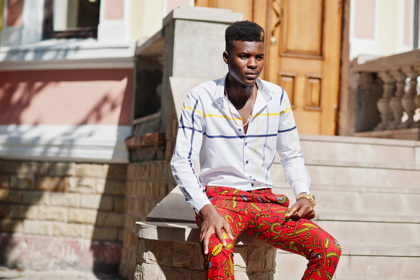 Portrait of handsome stylish african american model man in red t - Фото, зображення