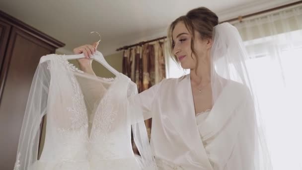 Beautiful and lovely bride in night gown and veil. Wedding dress. Slow motion - Footage, Video