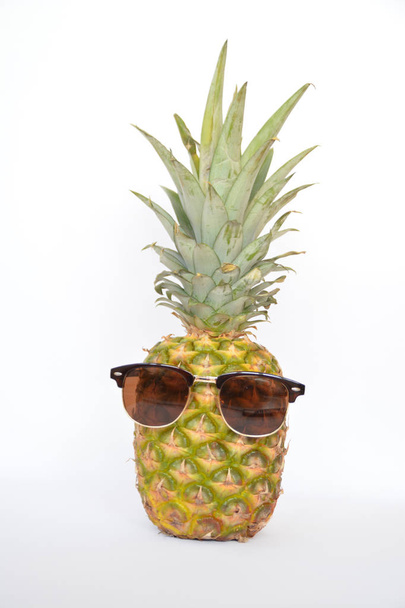 pineapple with sunglasses on white - 写真・画像