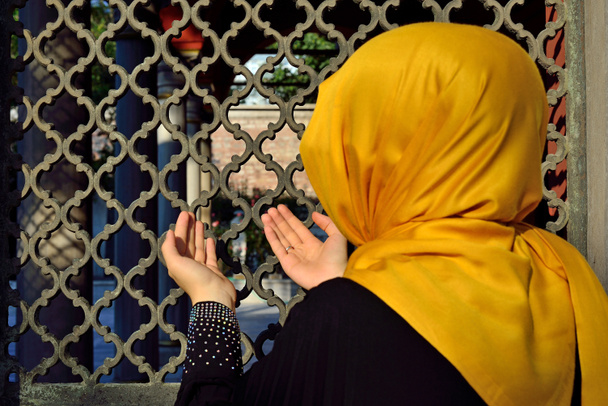Islamic old gravestone in a cemetery and women - Photo, Image