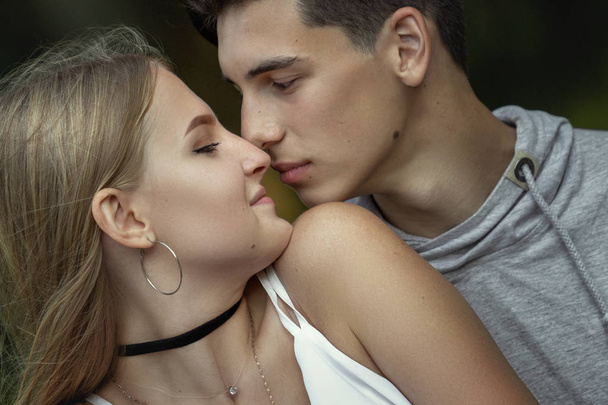 Portrait of a beautiful young couple in love. Teenagers. Man and woman outdoors - Foto, Imagem