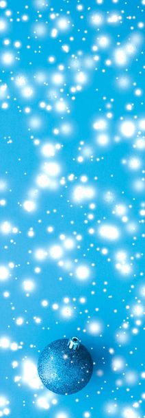 Christmas baubles on blue background with snow glitter, luxury w - Fotografie, Obrázek