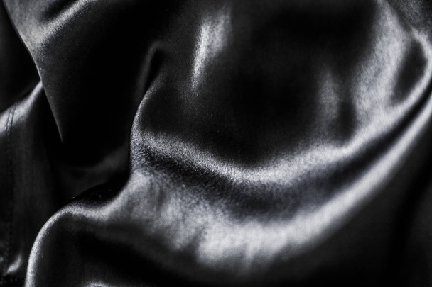 Luxury black soft silk flatlay background texture, holiday glamo - Foto, imagen