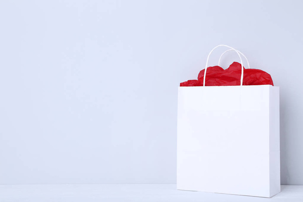 Paper shopping bag on grey background - Φωτογραφία, εικόνα