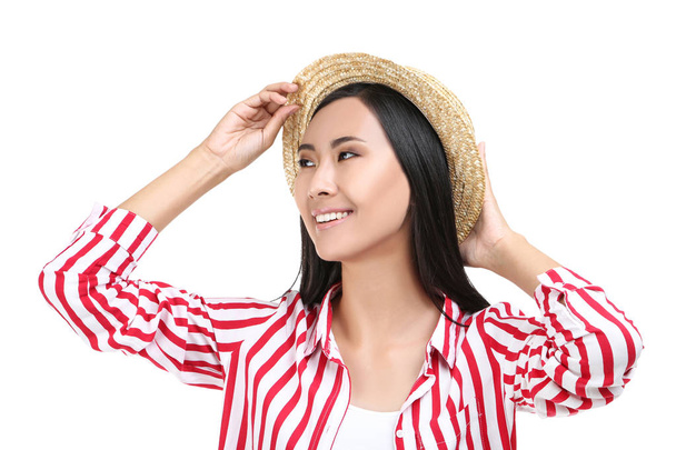 Beautiful young woman in straw hat on white background - Valokuva, kuva