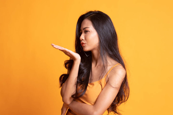 Beautiful young Asian woman blow a kiss. - 写真・画像