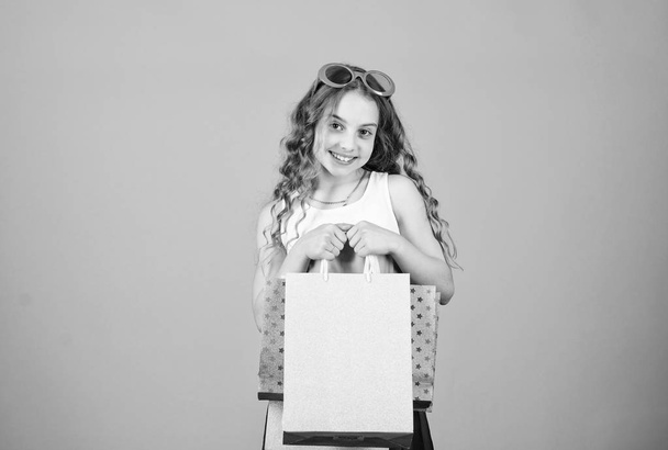 summer sales. Small girl fashion. happy birthday holiday. Beauty. black Friday discount. cyber Monday. Present and gifts buy. happy shopping girl with bags. In shopping store - Fotografie, Obrázek