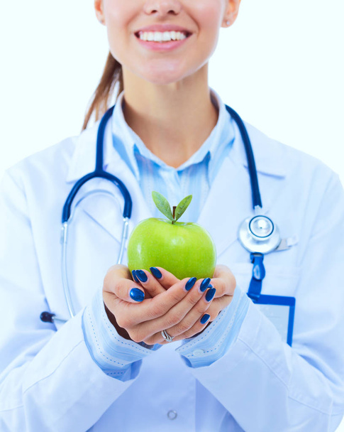 Smiling woman doctor with a green apple. Woman doctor - Photo, image