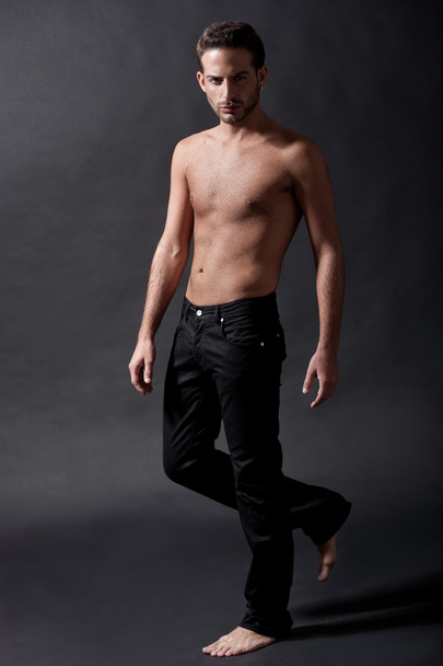 Fashion male model with black jean - Foto, afbeelding