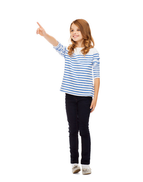 Girl pointing at imaginary screen - Фото, изображение