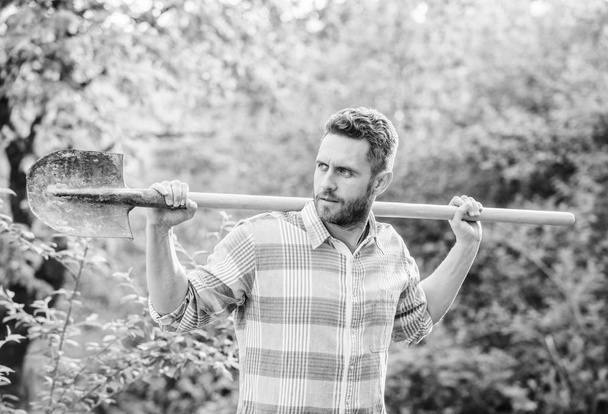 sexy farmer hold shovel. farming and agriculture cultivation. Garden tools. Eco farm worker. Harvest. happy earth day. Eco living. muscular ranch man. Working in green environment - Fotografie, Obrázek