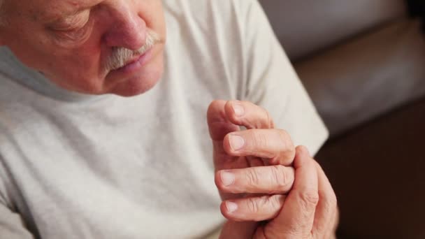 Senior man with involuntary hand movement - Footage, Video