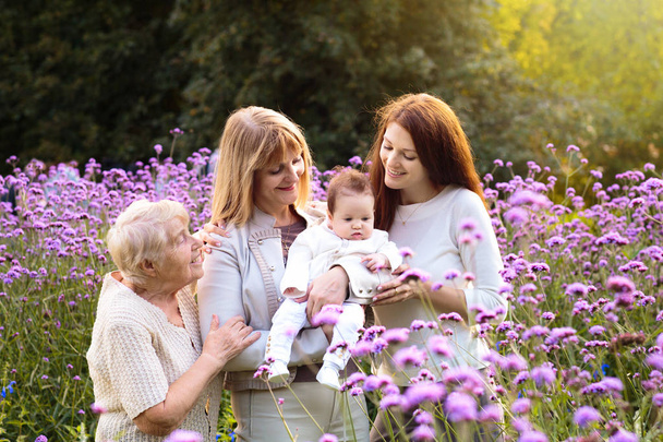 Grandmother, mother and kids. Family generations. - 写真・画像