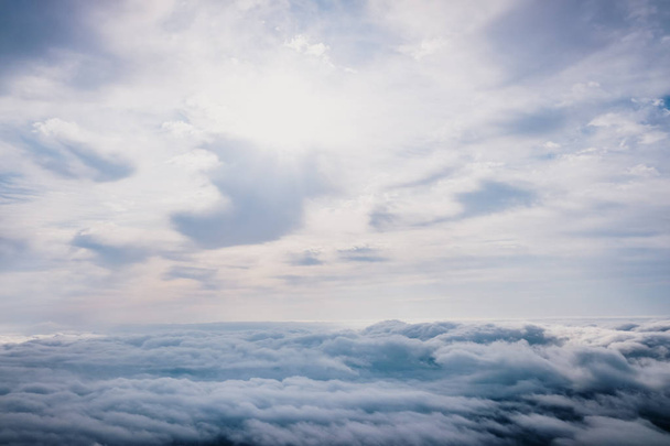 Awesome view on top of the clouds on a cloudy morning. - Fotó, kép