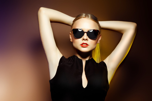 Fashion woman in sunglasses, studio shot. Professional makeup - Photo, Image
