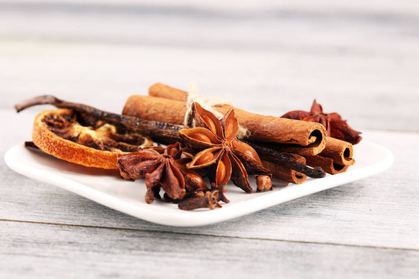 cinnamon, staranise and cloves. winter spices on wooden table - Foto, immagini