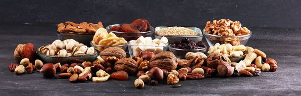 Composition with dried fruits and assorted healthy nuts on rusti - Photo, Image