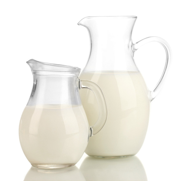 Milk in jugs isolated on white - Фото, изображение