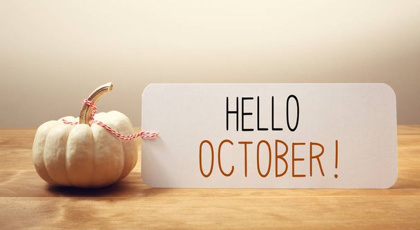 Hello October message with a small pumpkin - Foto, Imagen