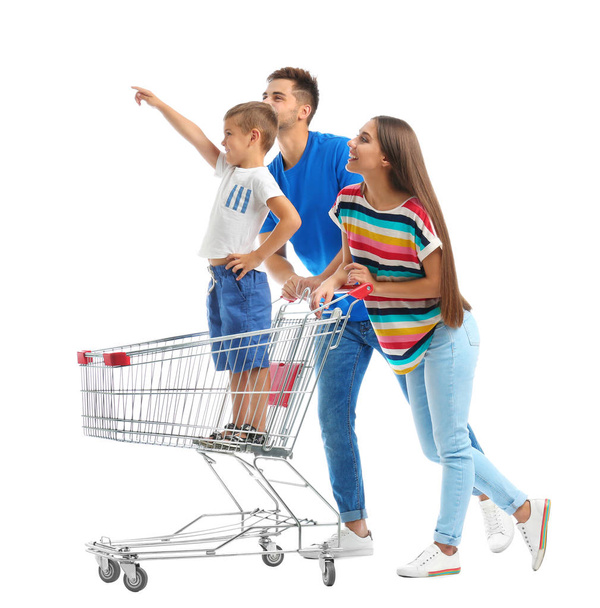 Happy family with shopping cart on white background - Valokuva, kuva