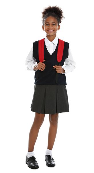 Happy African-American girl in school uniform on white background - Fotografie, Obrázek