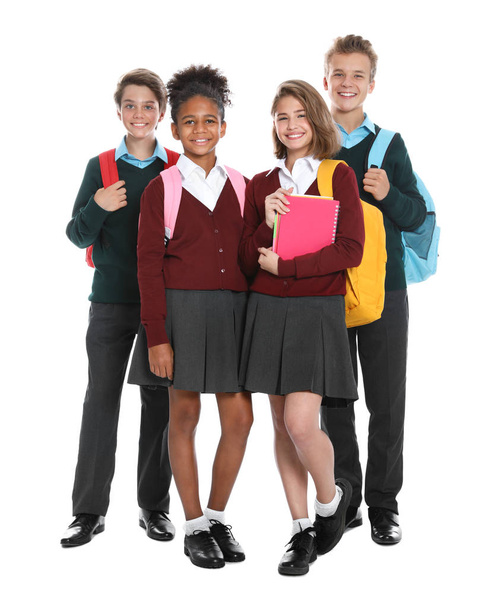 Happy pupils in school uniform on white background - Foto, Bild
