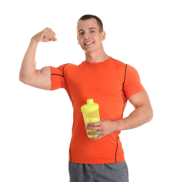 Athletic young man with protein shake on white background - Φωτογραφία, εικόνα