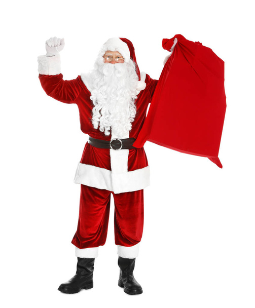 Authentic Santa Claus with bag full of gifts on white background - Photo, Image
