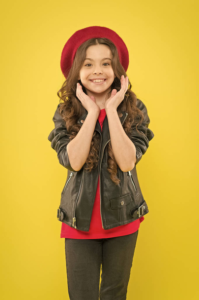 Discover the beauty within. Happy beauty girl smiling on yellow background. Beauty look of adorable small girl. Little child with charming smile on beauty face and brunette long hair - Zdjęcie, obraz