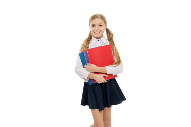 Perfect schoolgirl. Cute literature reader. Adorable little schoolgirl holding book english literature white background. Primary school child studying foreign language and literature. Enjoy learning - Zdjęcie, obraz