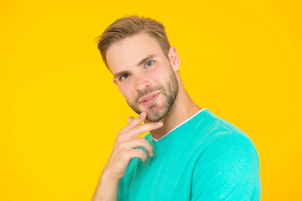 Think about. Self care. Handsome man yellow background. Well groomed guy with bristle and nice hairstyle. Male beauty. Barber hairdresser salon. Bearded man. Skin care. Facial care. Keep youth - Foto, Imagen