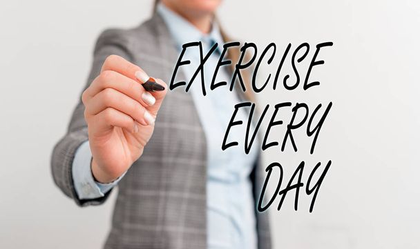 Conceptual hand writing showing Exercise Every Day. Business photo text move body energetically in order to get fit and healthy Business woman pointing in empty space with pen. - Photo, Image