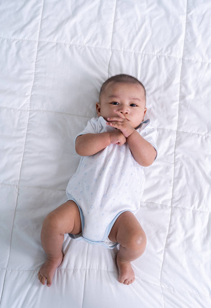 cheerful baby on a bed - Foto, Imagem