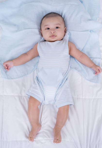cheerful baby on a bed - Foto, Bild