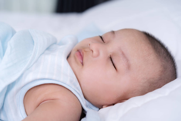 baby sleeping on a bed at home - Photo, Image