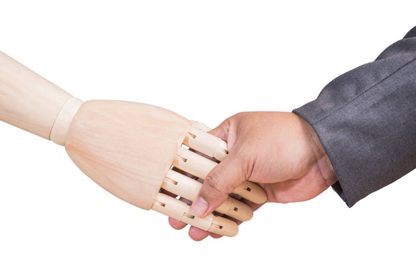 kunstmatige en menselijke hand zijn schudden isolaat op witte backgroun - Foto, afbeelding