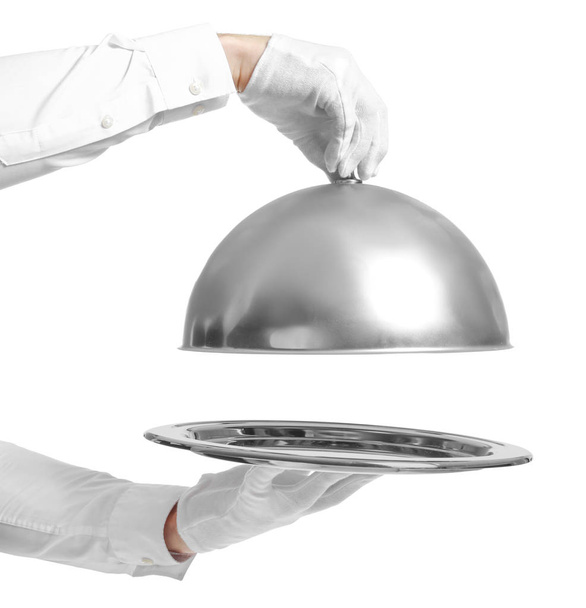 Hands of waiter with empty tray and cloche on white background - Photo, Image