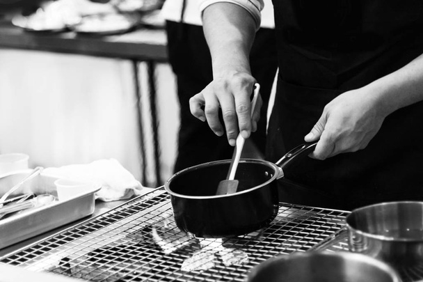 chef preparing food, chef cooking in a kitchen, chef at work, Bl - 写真・画像