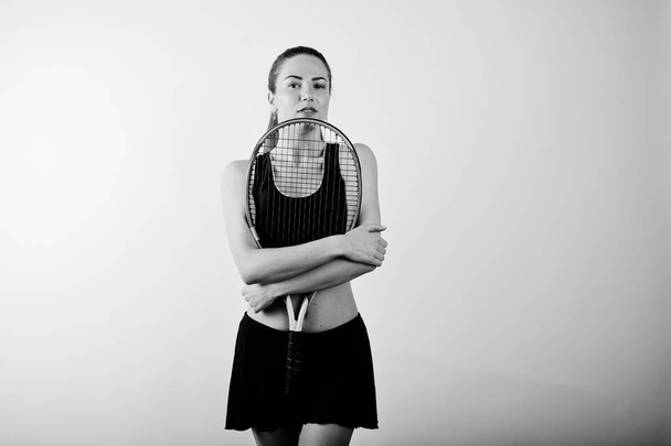 Black and white portrait of beautiful young woman player in spor - 写真・画像