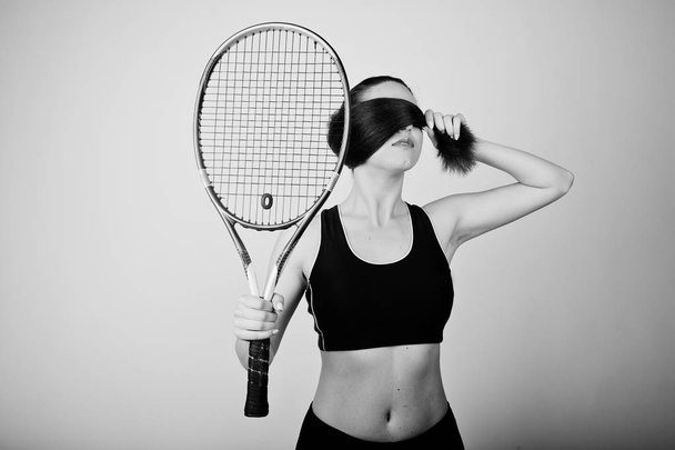 Black and white portrait of beautiful young woman player in spor - Photo, Image