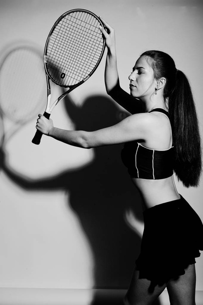 Black and white portrait of beautiful young woman player in spor - Valokuva, kuva