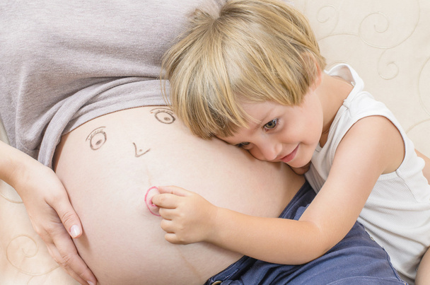 Child Embracing His Mother Tummy - Photo, Image