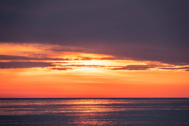 Beautiful red and orange sunset over the sea. - Valokuva, kuva