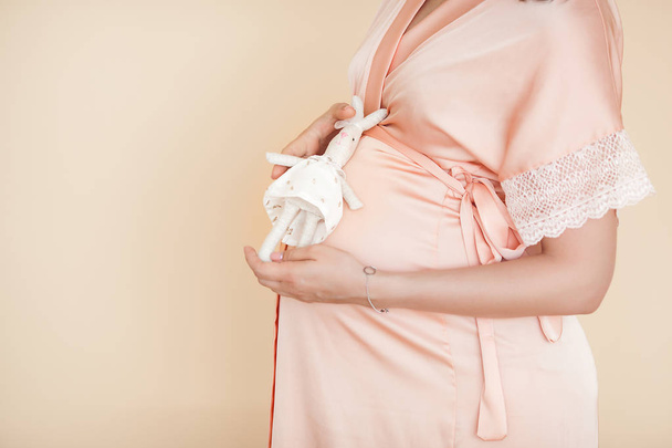 Closeup picture of pegnant woman. Unrecognizable expectant. Belly closeup. - Foto, immagini