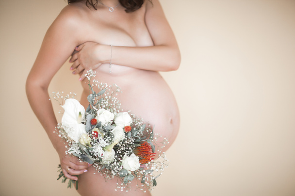Closeup picture of pegnant woman. Unrecognizable expectant. Belly closeup. - Photo, Image